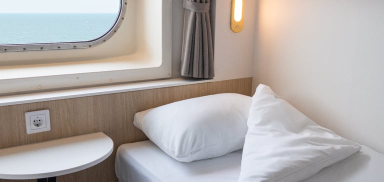 Bed in our standard cabin with seaview